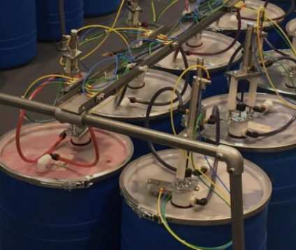Riverdale liquid color drums with integrated pumps and delivery lines